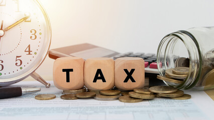 A desk with a calculator, tax forms, and a checklist of deductions, symbolizing strategies for maximizing tax savings for small businesses.